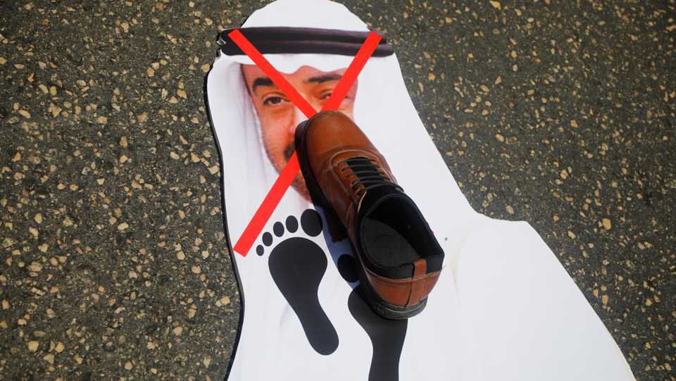 A shoe is placed on a poster depicting Abu Dhabi Crown Prince Mohammed bin Zayed al-Nahyan during a Palestinian protest against the UAE-Israel deal to normalise relations, in Nablus in the Israeli-occupied West Bank, August 14, 2020.