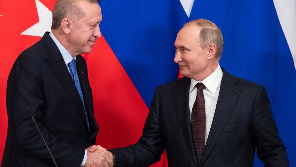 Turkish President Recep Tayyip Erdogan shakes hands with Russian President Vladimir Putin during a news conference following their talks in Moscow, Russia, March 5, 2020.