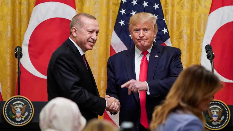 US President Donald Trump greets Turkey's President Recep Tayyip Erdogan during a joint news conference at the White House in Washington, US, November 13, 2019.