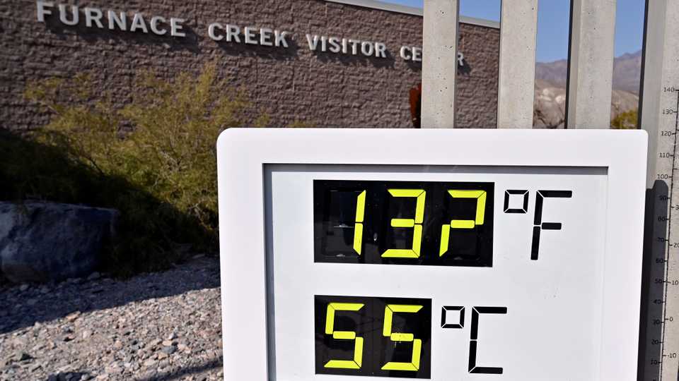 A thermometer reads 55.5 Celsius at the Furnace Creek Visitors Center in Death Valley, California, US, August 17, 2020.