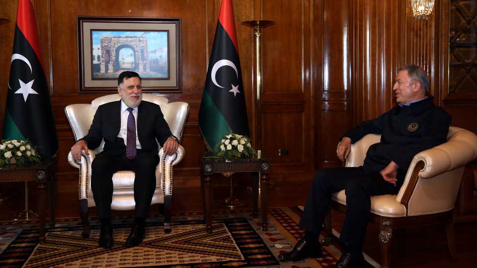 Turkish Defence Minister Hulusi Akar (R) meets with meets Prime Minister of Libya Fayez al Sarraj (L), in Tripoli, Libya, August 17, 2020.