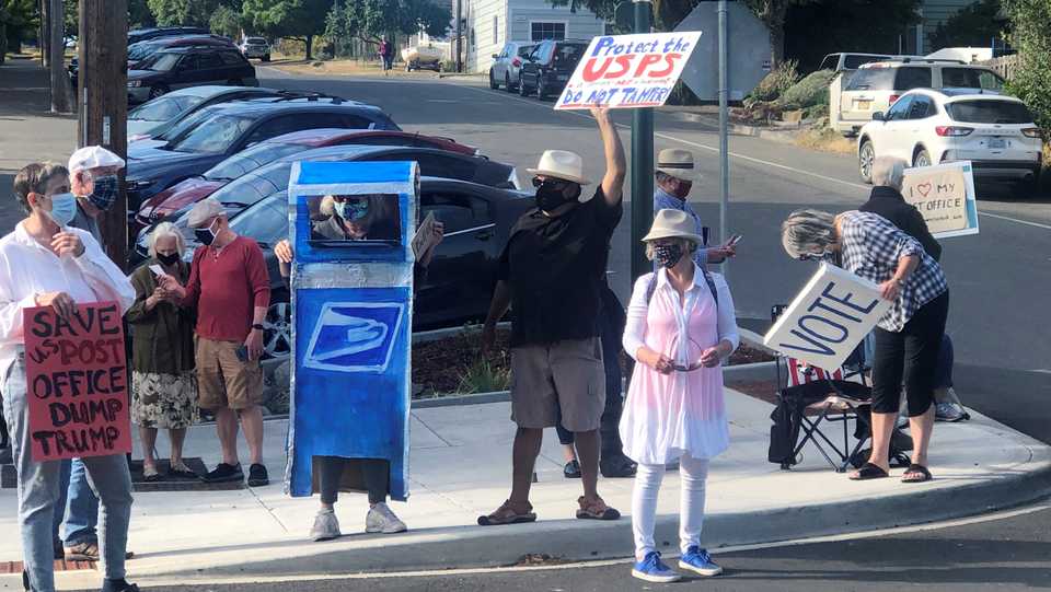 Residents hold a protest in support of the United States Postal Service in Port Townsend, Washington, US, August 18, 2020.
