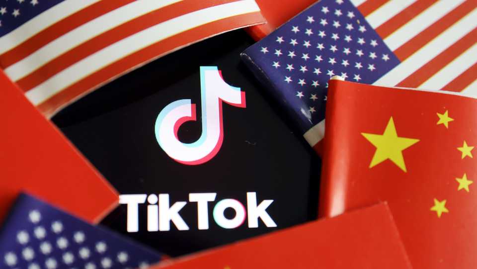 China and US flags are seen near a TikTok logo in this illustration picture. August 15, 2020.