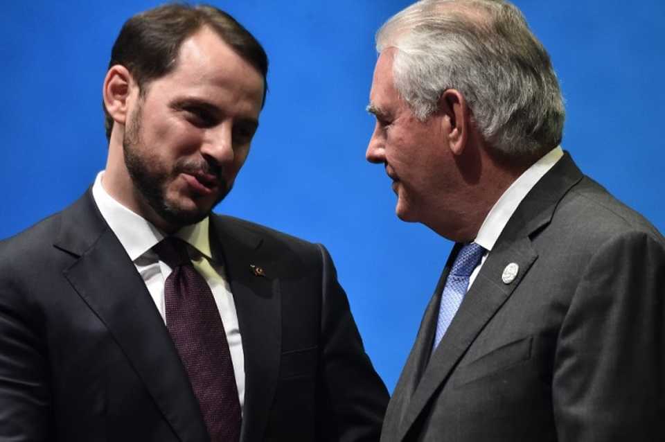 US Secretary of State Rex Tillerson speaks to Turkish Energy Minister Beraat Albayrak during the 22nd World Petroleum Congress opening ceremony on July 9, 2017 in Istanbul. 