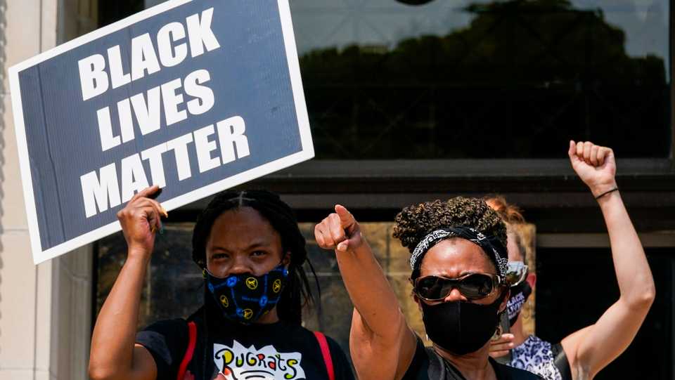 A small group of Black Lives Matter protesters hold a rally on the steps of the Kenosha County courthouse. August 24, 2020.