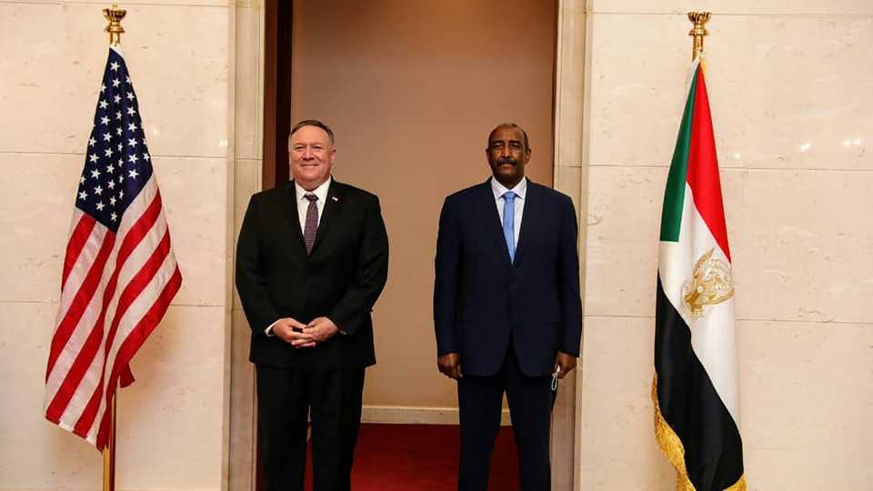 US Secretary of State Mike Pompeo poses for a picture with Sudan's Sovereign Council chief General Abdel Fattah al Burhan in Khartoum on August 25, 2020.