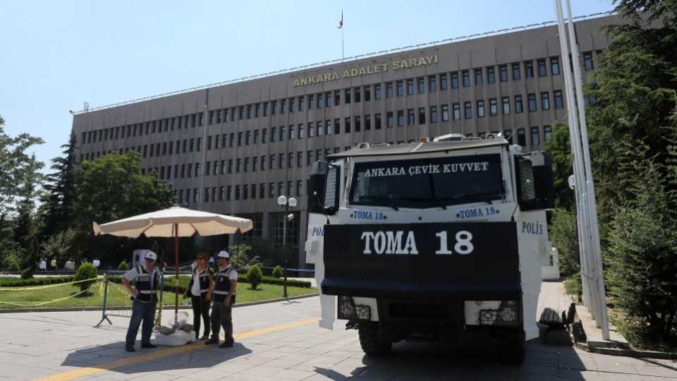 Members of the Turkish special forces stand guard by an armed vehicle in front of the Justice Palace in Ankara. The judiciary has been tasked with ascertaining which members of the military were involved in the coup.