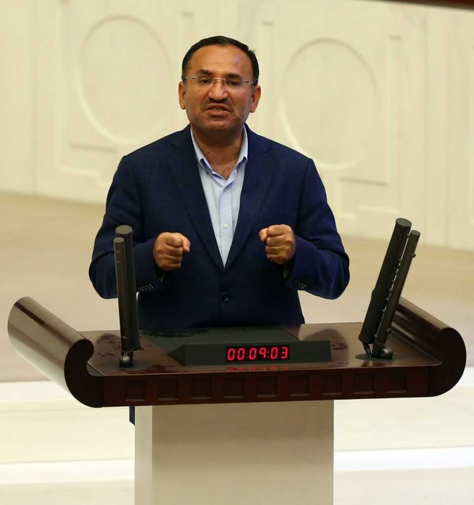 Bekir Bozdağ, MP and Justice Minister, refused to interrupt his speech and abandon the chamber even under bombardment.