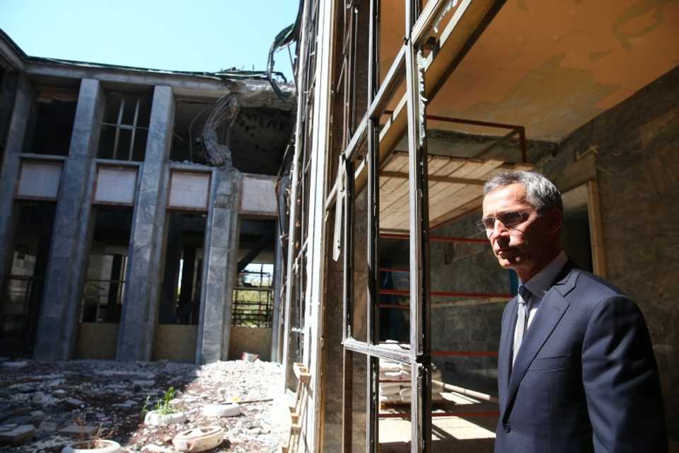 NATO Secretary-General Jens Stolenberg inspects bomb damage inside Turkey's Grand National Assembly during his visit to Ankara on 9th September 2016. 