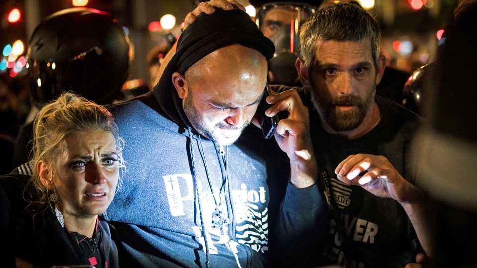 Joey Gibson, leader of the right wing Patriot Prayer group, arrives at the scene of a shooting amid weekend street clashes between supporters of Trump and counter-demonstrators in Portland, Oregon, US, August 29, 2020.