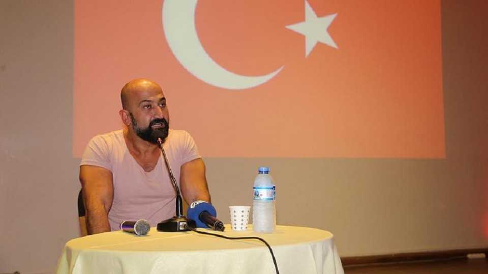 File photo shows Metin Dogan giving a speech on his experience of the failed coup at a conference.