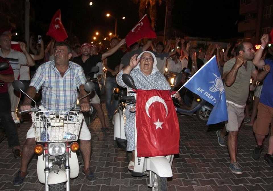 People march with Turkish flags in the resort town of Marmaris. 