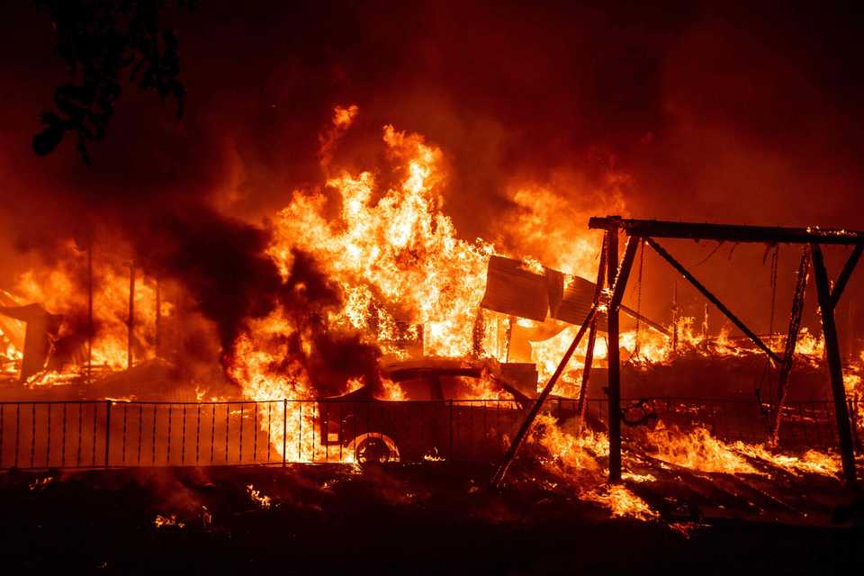 A home burns during the Bear fire, part of the North Lightning Complex fires in the Berry Creek area of unincorporated Butte County, California.