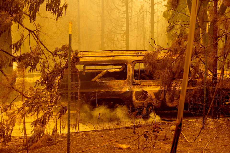 A scorched car rests in a clearing following the Bear Fire in Butte County, Calif., on Wednesday, Sept. 9, 2020.