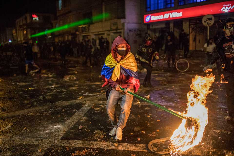 Demonstrators clash with police during protests sparked by the death of a man after he was detained by police in Bogota, September 9, 2020.