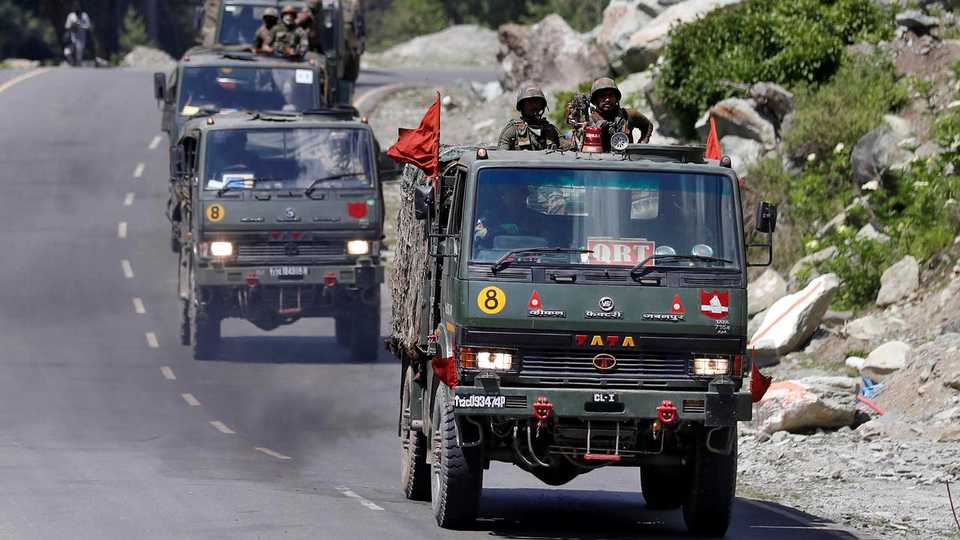 FILE PHOTO: An Indian Army convoy moves along a highway leading to Ladakh, at Gagangeer in Kashmir's Ganderbal district ON June 18, 2020.