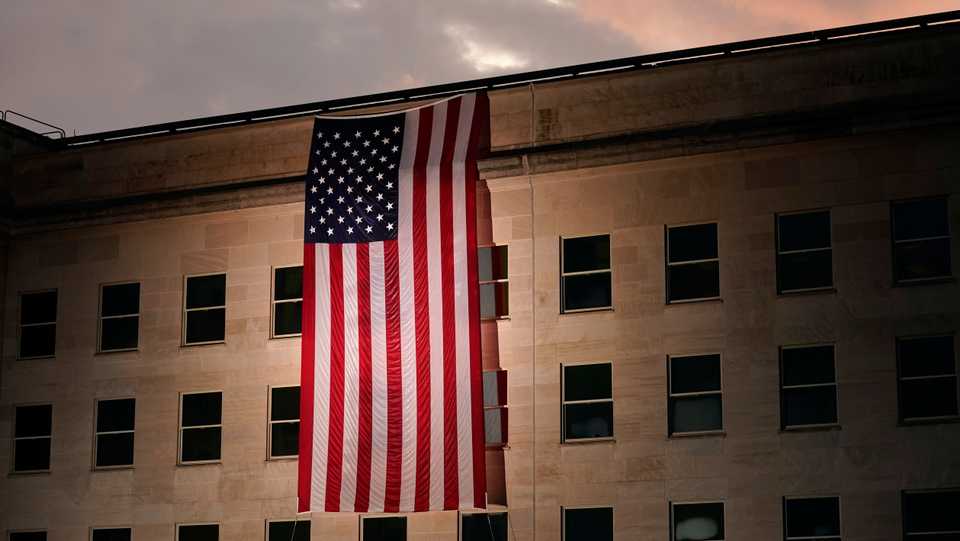 A large American flag is unfurled at the Pentagon ahead of ceremonies at the National 9/11 Pentagon Memorial to honour the 184 people killed in the 2001 terrorist attack on the Pentagon, in Washington. September 11, 2020.