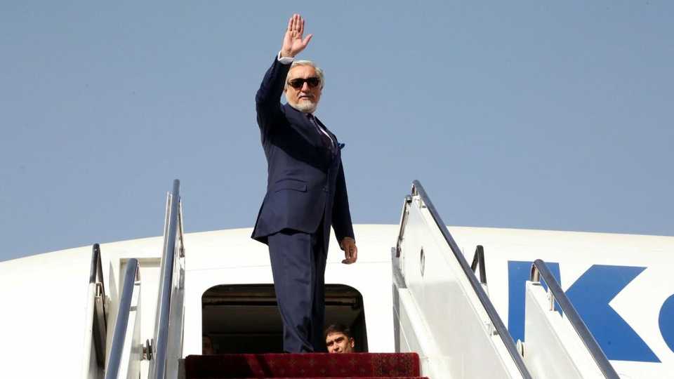 Abdullah Abdullah, chairman of the High Council for National Reconciliation waves goodbye before departing from Kabul, Afghanistan to Doha, Qatar, September 11, 2020.