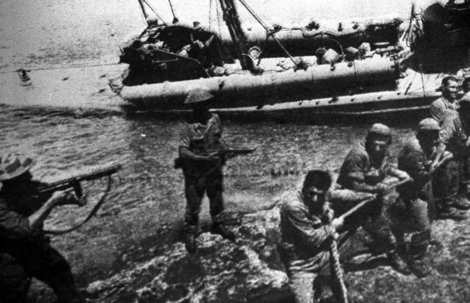 Turkish troops pull ashore a Greek Cypriot torpedo boat damaged during the fighting in Kyrenia on July 20 1974, the day Turkey landed and marched on the northern third of Cyprus.