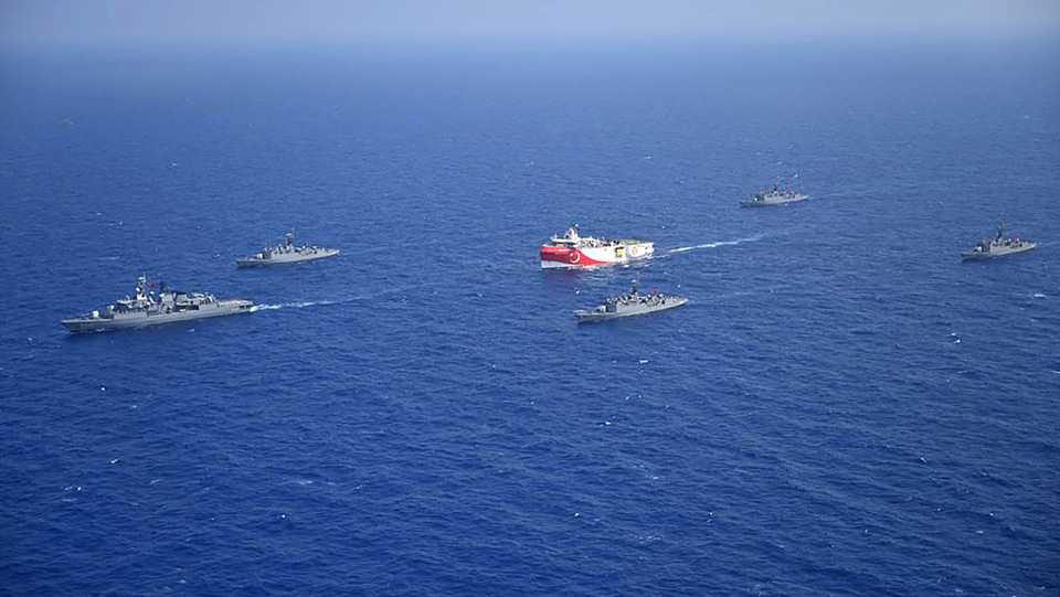 Turkish Defence Ministry photo shows Turkish seismic research vessel Oruc Reis (C) as it is escorted by Turkish Naval ships in the Mediterranean Sea on August 12, 2020.