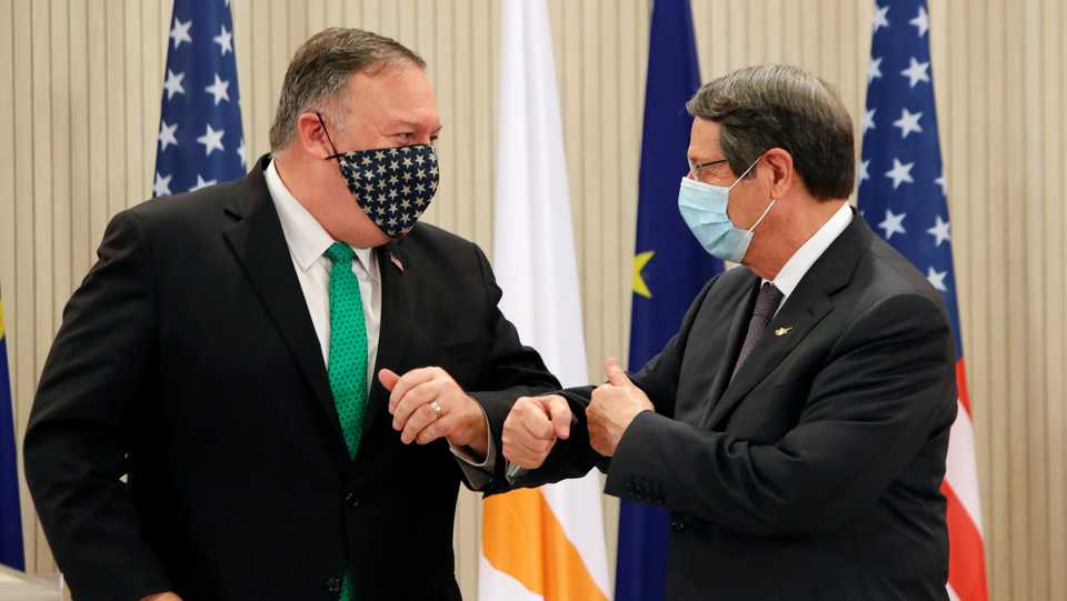US Secretary of State Mike Pompeo and Cypriot President Nicos Anastasiades elbow bump after a news conference at the Presidential Palace in Nicosia, September 12, 2020.