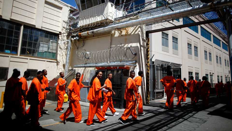 Inmates walk in San Quentin state prison in San Quentin, California, US on June 8, 2012.