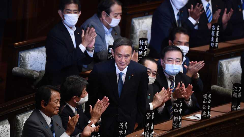 Newly elected leader of Japan's Liberal Democratic Party (LDP) Yoshihide Suga (3rd L) is applauded after he was elected as Japan's prime minister by the Lower House of parliament in Tokyo on September 16, 2020.