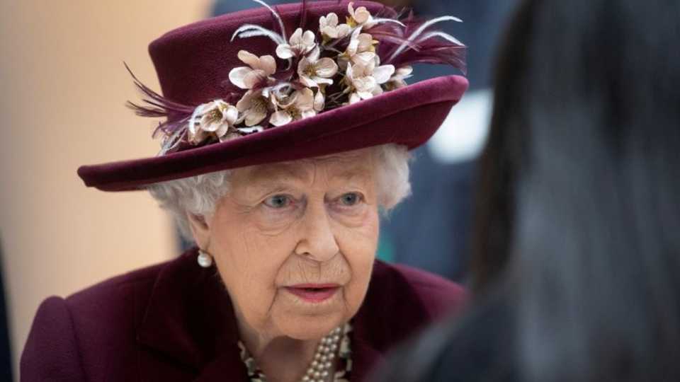 Britain's Queen Elizabeth talks with MI5 officers in London on February 25, 2020.