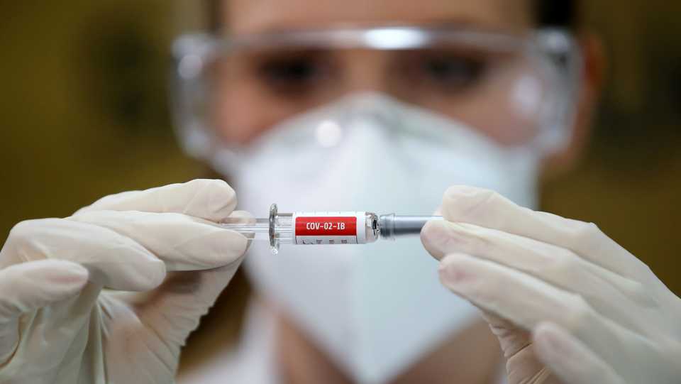 A nurse holds China's Sinovac potential vaccine for Covid-19 at the Sao Lucas Hospital of the Pontifical Catholic University of Rio Grande do Sul (PUCRS), in Porto Alegre, Brazil. August 8, 2020.
