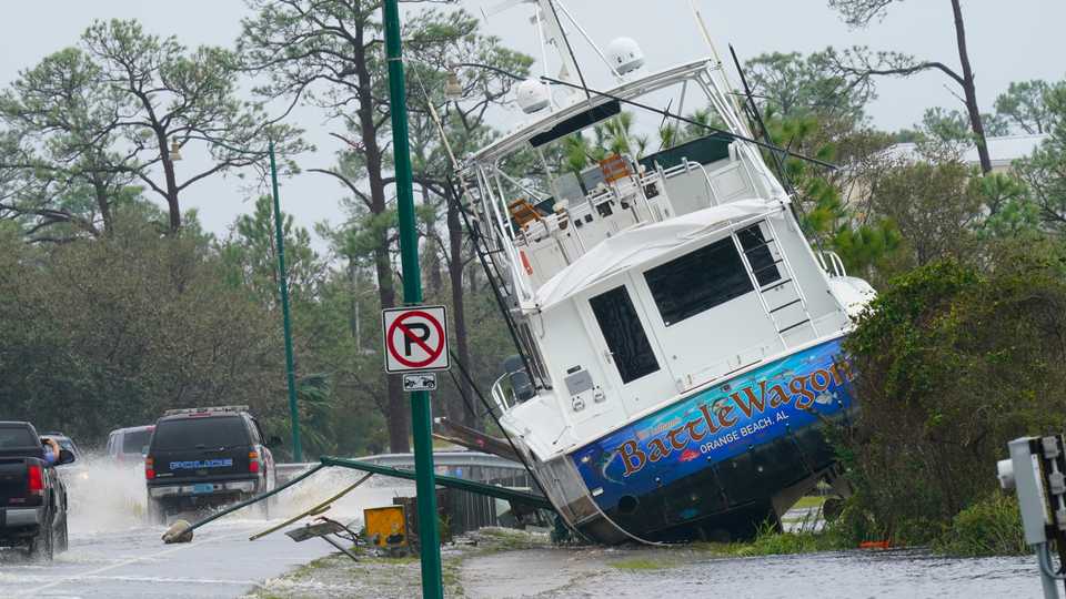 A boat is washed up near a road after Hurricane Sally moved through the area, in Orange Beach, Alabama, September 16, 2020.