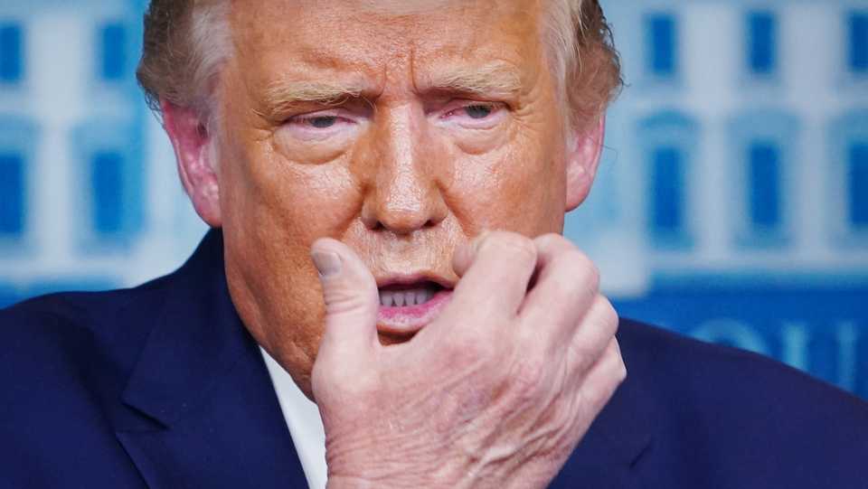 US President Donald Trump gestures while speaking about mask wearing during a press conference in the Brady Briefing Room of the White House in Washington, DC on September 16, 2020.