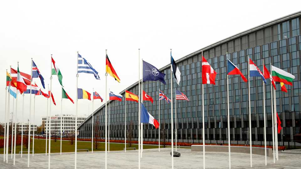 Flags of NATO member countries are seen at the Alliance headquarters in Brussels, Belgium.
