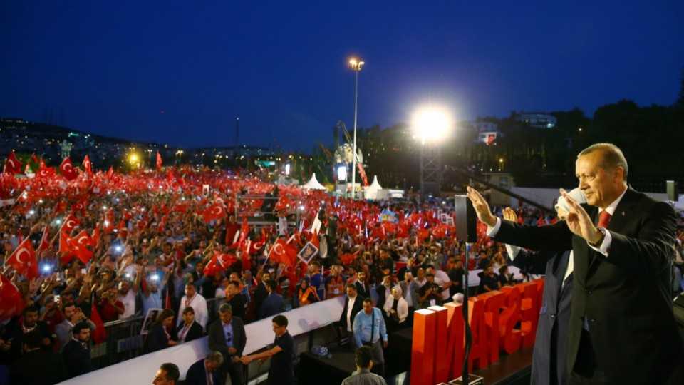 Turkey's President Recep Tayyip Erdogan delivers an address to hundreds of thousands of people on the July 15 Martyrs Bridge in Istanbul.