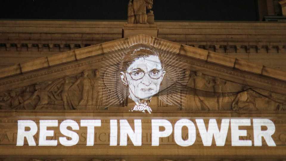 An image of associate justice of the US Supreme Court Ruth Bader Ginsburg is projected onto the New York State Civil Supreme Court building on September 18, 2020.