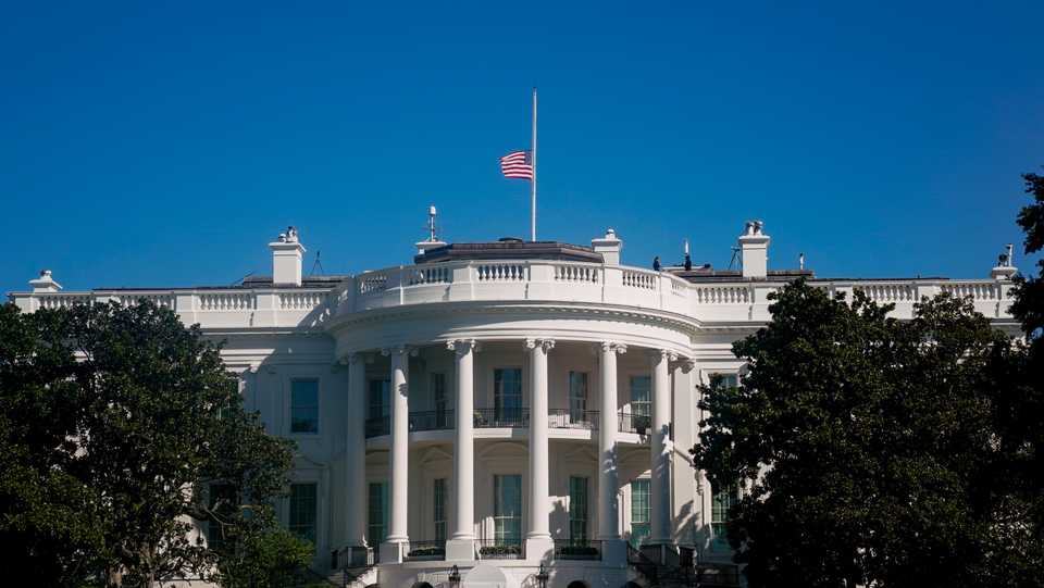 The American flag above the White House is seen at half staff after the death of Supreme Court Justice Ruth Bader Ginsburg, in Washington, U.S. September 20, 2020.