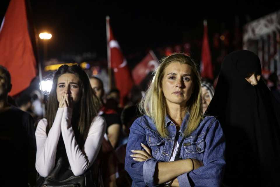 Women cry as they listen Turkish President Recep Tayyip Erdogan's speech at July 15 Martyrs Bridge, in front of the Istanbul Metropolitan Municipality during the July 15 Democracy and National Unity Day in Istanbul, Turkey on July 15, 2017. (AA