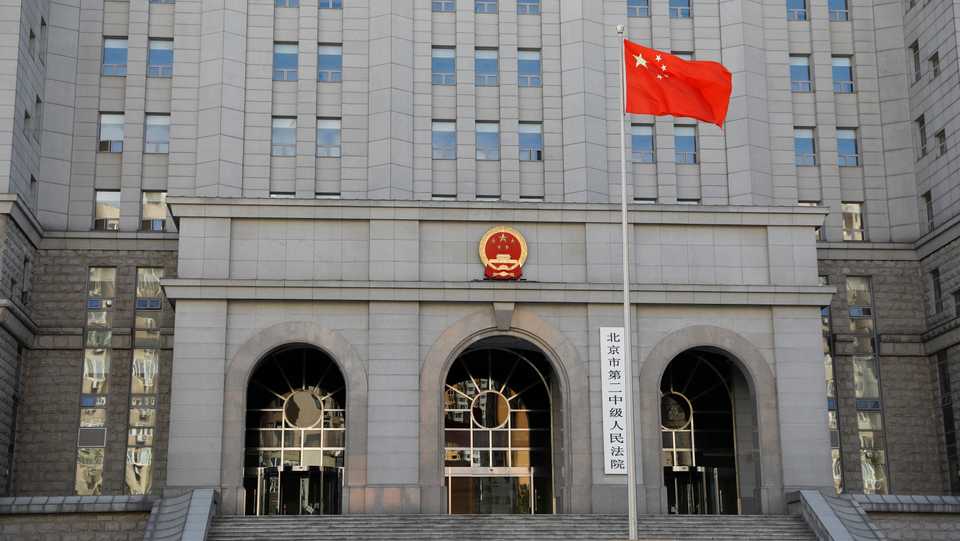 A Chinese flag flutters at Beijing No. 2 Intermediate People's Court, where Huayuan Real Estate Group former chairman Ren Zhiqiang has been charged in a corruption trial, in Beijing, China September 11, 2020.