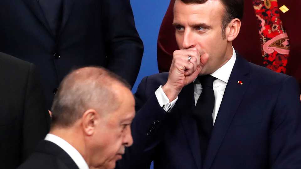 France's President Emmanuel Macron gestures next to Turkey's President Recep Tayyip Erdogan during a photo opportunity at the NATO leaders summit in Watford, Britain December 4, 2019.
