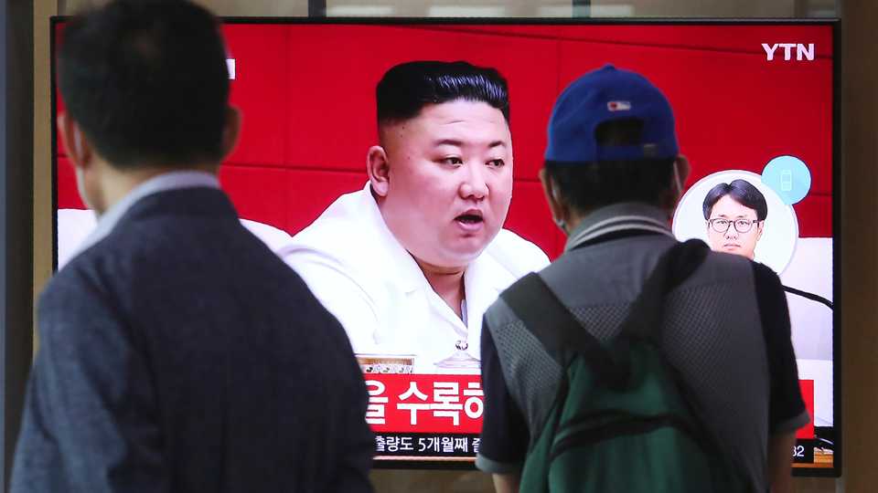 People watch a screen showing a file image of North Korean leader Kim Jong-un during a news program at the Seoul Railway Station in Seoul, South Korea on Sept. 25, 2020.