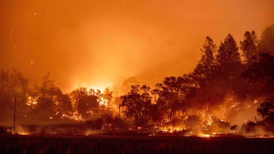 In this long exposure photograph, burning hills create a flaming landscape during the Glass fire in Napa County's St. Helena, California on September 27, 2020.