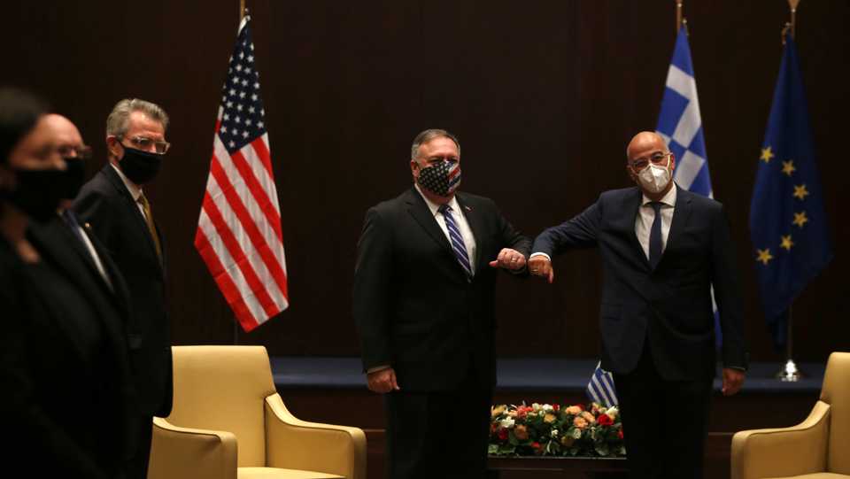 US Secretary of State Mike Pompeo and Greek Foreign Minister Nikos Dendias touch elbows during their meeting in Thessaloniki, Greece, September 28, 2020.