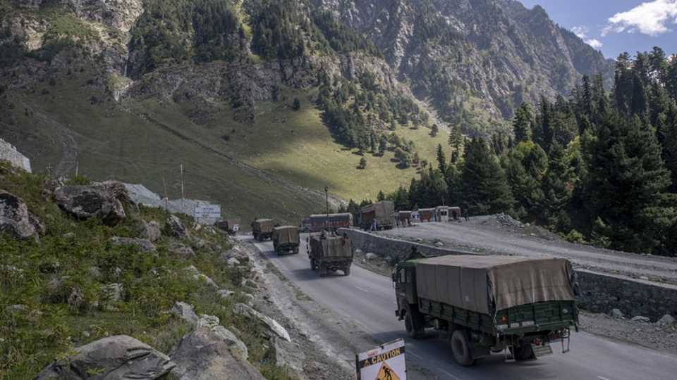 In this September 9, 2020 file photo, an Indian army convoy moves on the Srinagar- Ladakh highway at Gagangeer, northeast of Srinagar, in India-administered Kashmir.