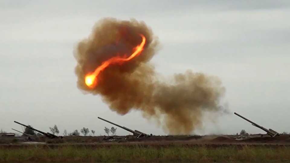 An image grab taken from a video allegedly shows Azerbaijani artillery strike towards the positions of Armenian separatists in the occupied Karabakh, September 28, 2020. Handout / Azerbaijani Defence Ministry