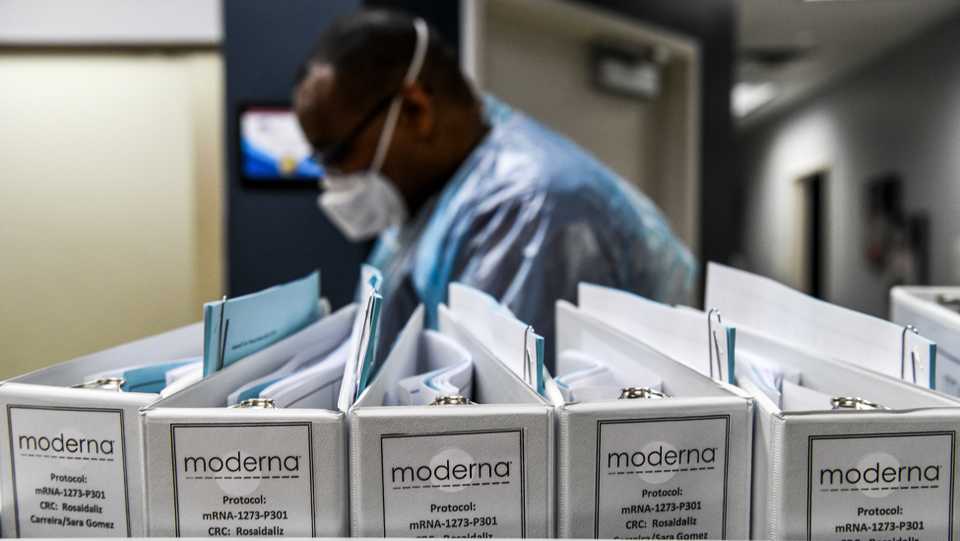 In this file photo taken on August 13, 2020 Biotechnology company Moderna protocol files for Covid-19 vaccinations are kept at the Research Centres of America in Hollywood, Florida. US biotech firm Moderna won't seek an emergency use authorization for its coronavirus vaccine before November 25, its CEO told the Financial Times on September 30.