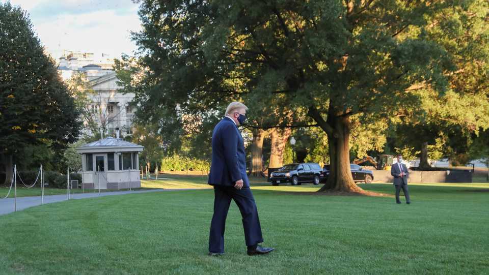 US President Trump walks to the Marine One helicopter as he departs the White House to fly to Walter Reed National Military Medical Center, October 2, 2020