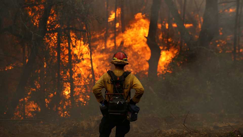 A California firefirefighter monitors a firing operation while battling the Glass fire in Calistoga, California, US, October 2, 2020.