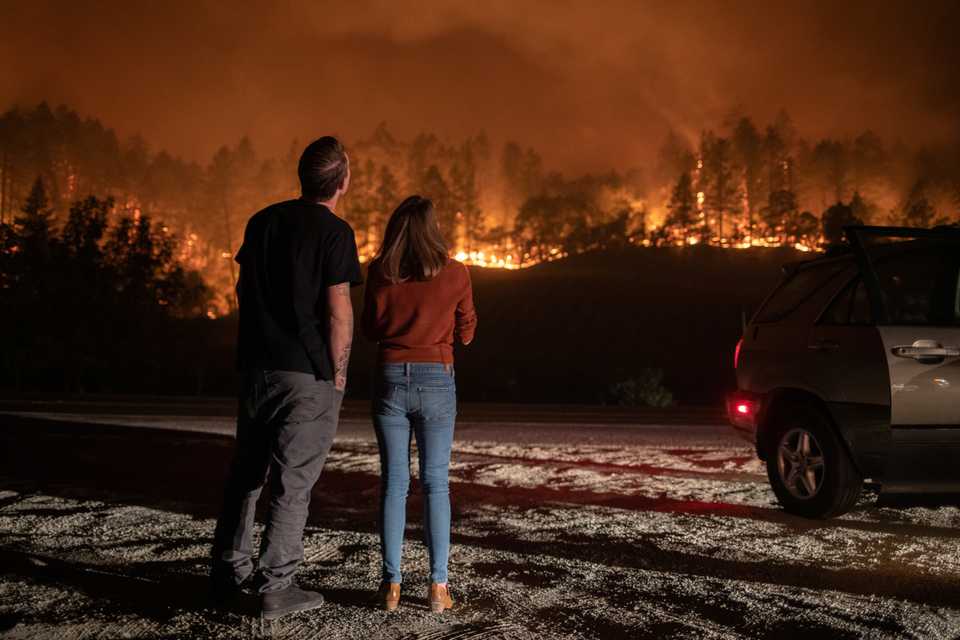 Napa Valley residents Matthew Rivard and Amanda Crean watch the Glass fire burn in Calistoga, California, US, September 28, 2020.
