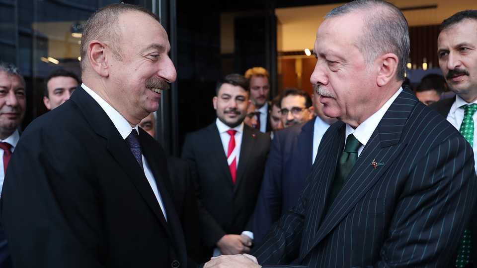In this file photo from October 19, 2018, Turkey's President Erdogan (E) and Azerbaijan President Aliyev (L) meet in Aliaga, Turkey, where Azerbaijani state oil company SOCAR's Turkish subsidiary is headquartered.