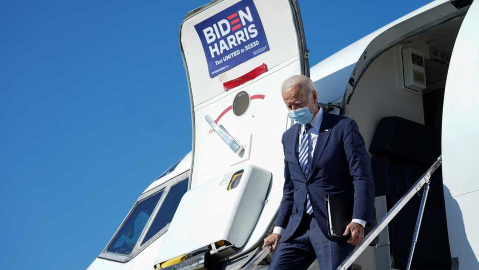 US Democratic presidential candidate Joe Biden steps from his plane en route to a campaign event in Pennsylvania at Hagerstown Regional Airport in Hagerstown, Maryland, US, October 6, 2020.