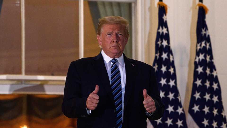US President Trump gives two thumbs up upon his return to the White House from Walter Reed Medical Center, where he underwent treatment for Covid-19, in Washington, DC. October 5, 2020.